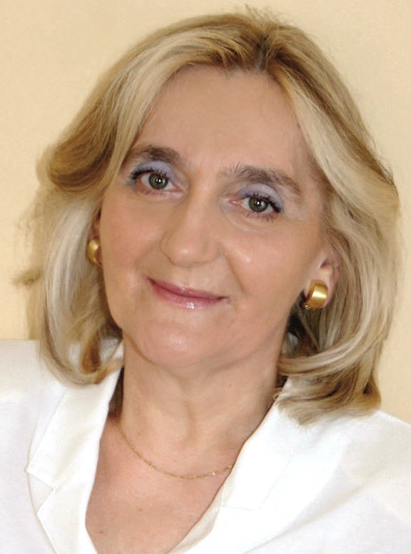 Elżbieta Świgulska, kobieta w średnim wieku, blondynka, bibliotekarka